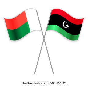 Malagasy and Libyan crossed flags. Madagascar combined with Libya isolated on white. Language learning, international business or travel concept.