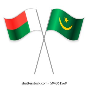 Malagasy and Mauritanian crossed flags. Madagascar combined with Mauritania isolated on white. Language learning, international business or travel concept.