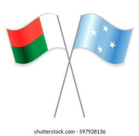 Malagasy and Micronesian crossed flags. Madagascar combined with Micronesia isolated on white. Language learning, international business or travel concept.
