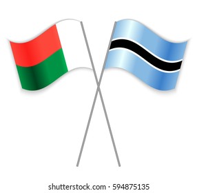 Malagasy and Motswana crossed flags. Madagascar combined with Botswana isolated on white. Language learning, international business or travel concept.