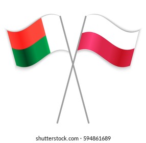 Malagasy and Polish crossed flags. Madagascar combined with Poland isolated on white. Language learning, international business or travel concept.