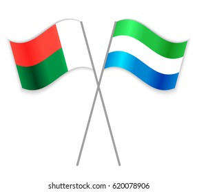 Malagasy and Sierra Leonean crossed flags. Madagascar combined with Sierra Leone isolated on white. Language learning, international business or travel concept.