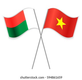 Malagasy and Vietnamese crossed flags. Madagascar combined with Vietnam isolated on white. Language learning, international business or travel concept.