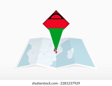 Malawi is depicted on a folded paper map and pinned location marker with flag of Malawi. Folded vector map.