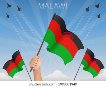 Banderas de Malawi ondeando bajo el cielo azul
