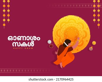 Malayalam Lettering Of Happy Onam With Top View Of South Indian Woman Making Rangoli (Atham) And Marigold Garland (Toran) On Claret Background.