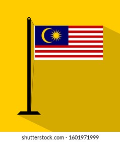 malaysia flag on pole, isolated on yellow background