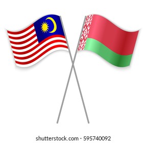 Malaysian and Belarusian crossed flags. Malaysia combined with Belarus isolated on white. Language learning, international business or travel concept.