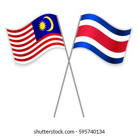 Malaysian and Costa Rican crossed flags. Malaysia combined with Costa Rica isolated on white. Language learning, international business or travel concept.