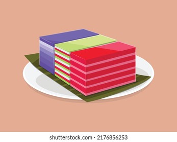 Malaysian Nyonya dessert Kuih Lapis. A multicolored glutinous rice layer cake with pandan leaves on plate