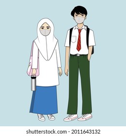 Malaysian Teenage Boy And Girl Wearing The Secondary School Uniform With Face Mask On During The COVID-19 Pandemic.