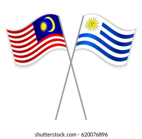 Malaysian and Uruguayan crossed flags. Malaysia combined with Uruguay isolated on white. Language learning, international business or travel concept.