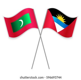 Maldivian and Antiguan crossed flags. Maldives combined with Antigua and Barbuda isolated on white. Language learning, international business or travel concept.