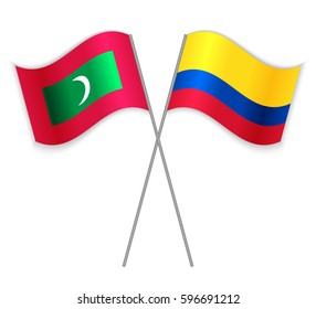 Maldivian and Colombian crossed flags. Maldives combined with Colombia isolated on white. Language learning, international business or travel concept.