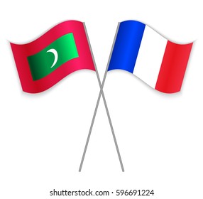 Maldivian and French crossed flags. Maldives combined with France isolated on white. Language learning, international business or travel concept.