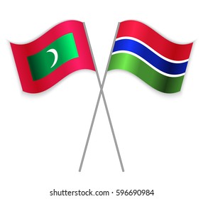 Maldivian and Gambian crossed flags. Maldives combined with Gambia isolated on white. Language learning, international business or travel concept.
