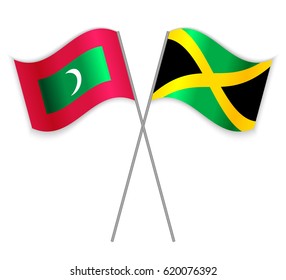 Maldivian and Jamaican crossed flags. Maldives combined with Jamaica isolated on white. Language learning, international business or travel concept.