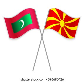 Maldivian and Macedonian crossed flags. Maldives combined with Macedonia isolated on white. Language learning, international business or travel concept.