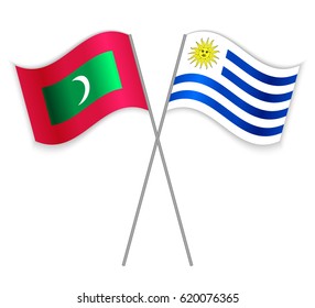 Maldivian and Uruguayan crossed flags. Maldives combined with Uruguay isolated on white. Language learning, international business or travel concept.