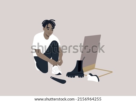 A male African character trying different pairs of shoes on, an in-store shopping