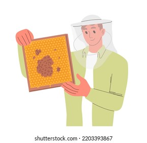 Male beekeeper hold wooden frame with honeycomb.
