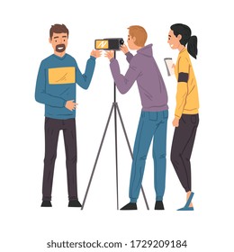 Male Blogger Streaming Online, Cameraman and Assistant Recording Video with Camera on Tripod, Social Media Blogging Cartoon Vector Illustration