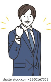 A male businessperson doing a fist pump
