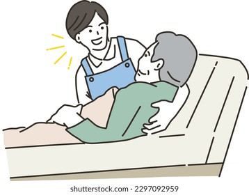 Male caregiver helping to get up in bed