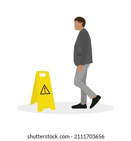 A male character in a business suit stands near a floor warning sign on a white background