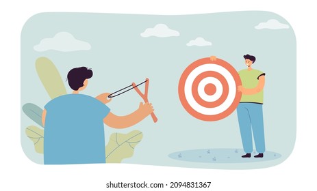 Male character catapulting at target that his friend holding. Man aiming at shooting mark from slingshot flat vector illustration. Goal achievement concept for banner, website design, landing web page