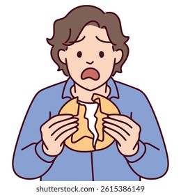 Male character eating Dalgona candy with visible stress and disappointment, breaking the cookie during the challenge