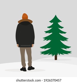 Male character in a jacket and hat stands with his back in the snow and looks at a green spruce
