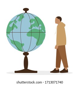 Male character looks at a huge globe