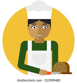 Male character, portrait of young baker cutting bread with knife