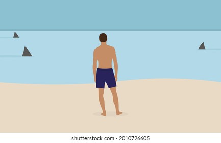 Male character in shorts stands on the beach and looks at shark fins in the water