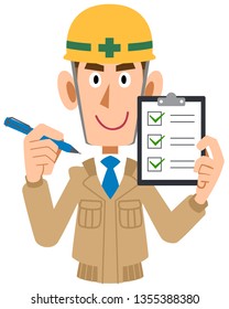 Male construction worker holding checklist in hand