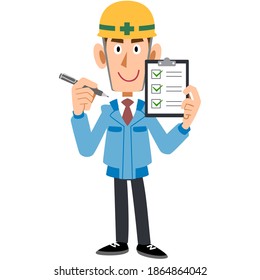 Male construction worker holding a checklist
