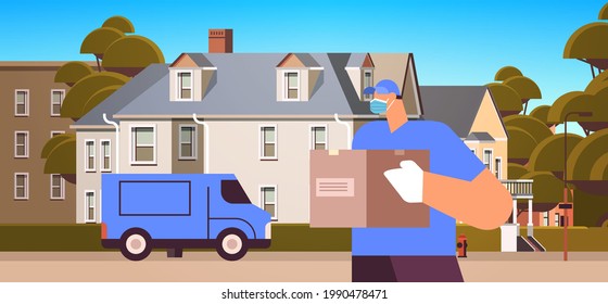 Male Courier In Mask And Gloves Holding Cardboard Box Contactless Delivery Medical Courier Service Concept