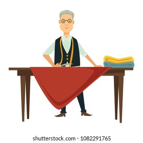 Male designer works on new outfit at table