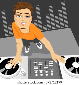 male disc jockey mixing the track using his turntables
