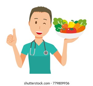 Male doctor in green scrub has vegetables