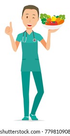 Male doctor in green scrub has vegetables
