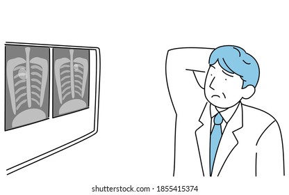 A male doctor scratching his head when he sees a shadow on an X-ray of his lungs