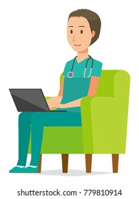 A male doctor wearing a green scrub sits on the sofa and is operating a laptop computer