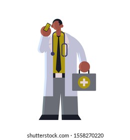 male doctor in white coat with first aid kit talking on mobile phone medicine healthcare concept african american medical clinic worker with stethoscope standing pose full length flat vector