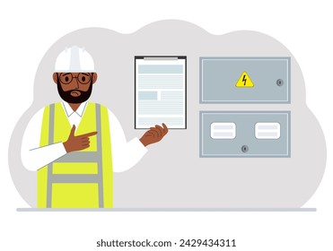 A male electrical engineer holds a clipboard with a contract and stands next to an electrical cabinet. The concept of a contract for service, connection of electricity or hiring a specialist.