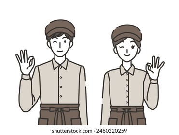 Male and female cafe clerks in okay pose