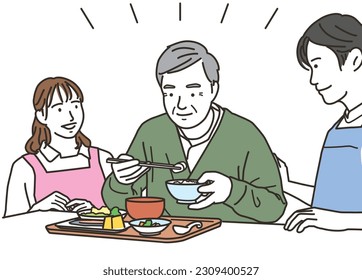 Male and female caregivers and elderly men who assist with meals
