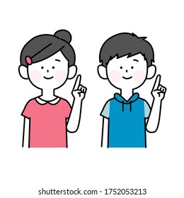 Male and female children pointing with a smile