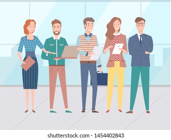 Male and female colleagues, office workers standing together holding tablets, documents and laptop. Group of people discussing business issues, teamwork concept